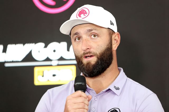 Jon Rahm expresses his displeasure towards a rowdy spectator at the LIV Golf UK event, sarcastically stating, “Oh, please, feel free to holler during our backswing, you absolute genius.”